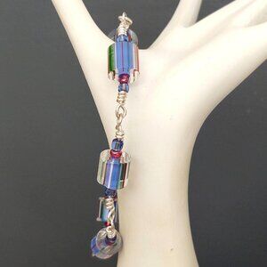 Clear glass bracelet with red, blue and green accents-toggle closure